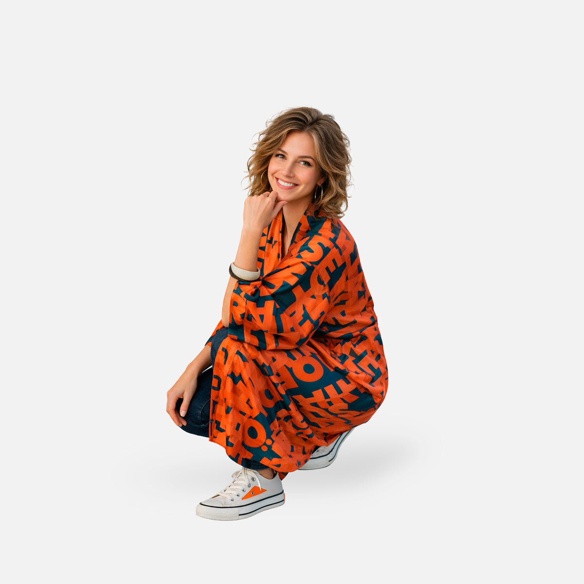 Woman wearing a colorful kimono with a print featuring women in history
