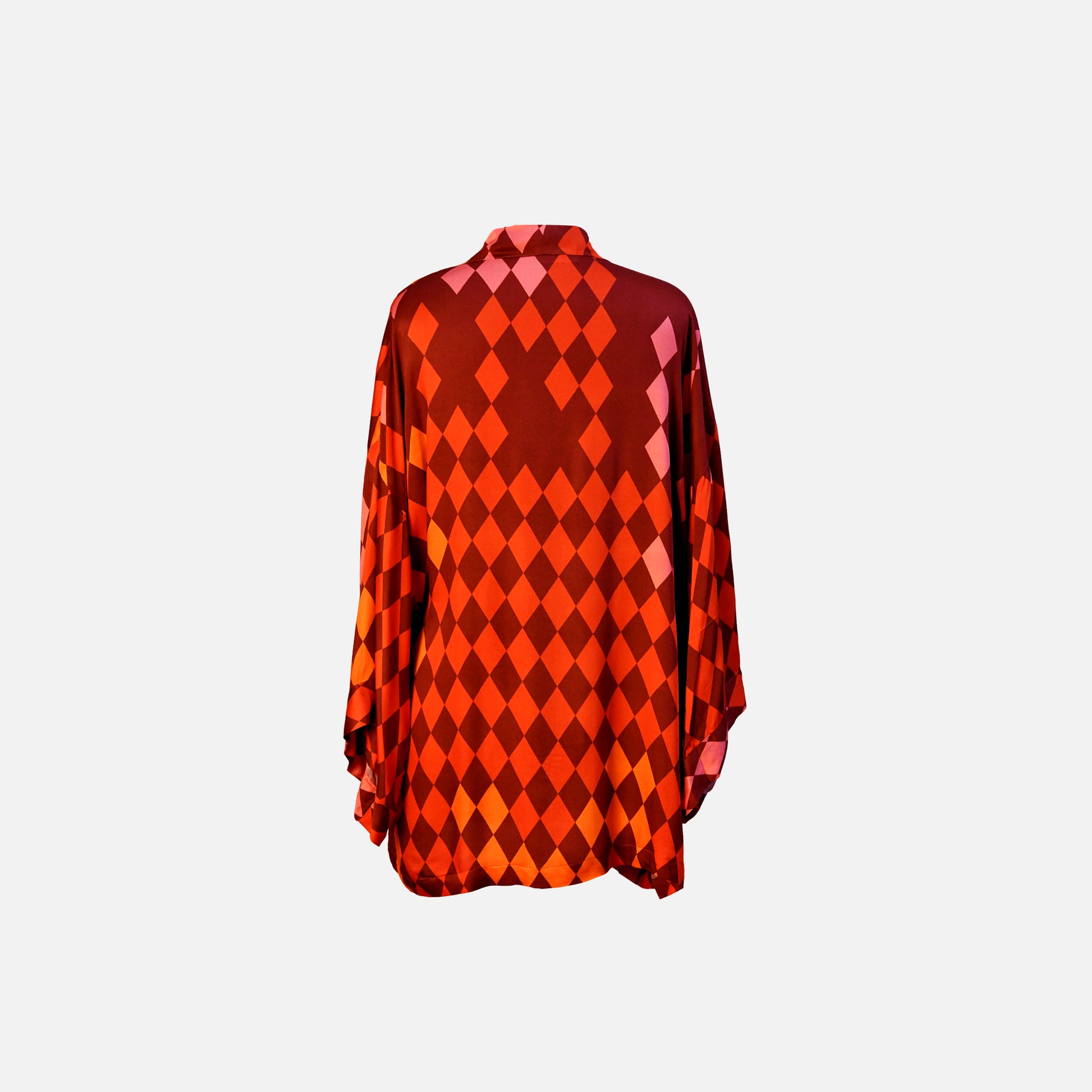 Kimono in warm shades of red, pink, orange and terracotta, back view